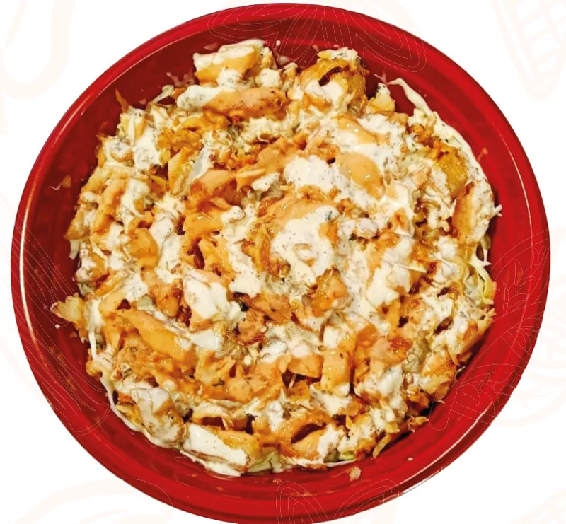 Kebab rice with shredded chicken and sauce in a red bowl
